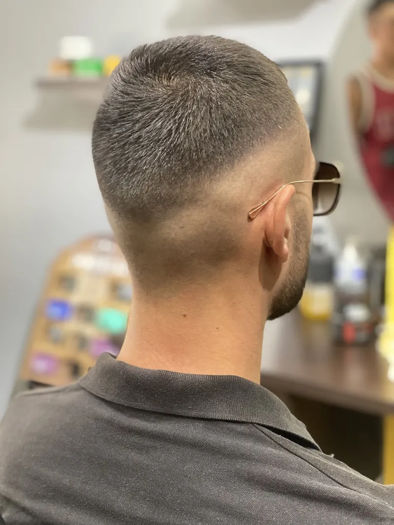 Short textured crop with a high fade, seen from behind