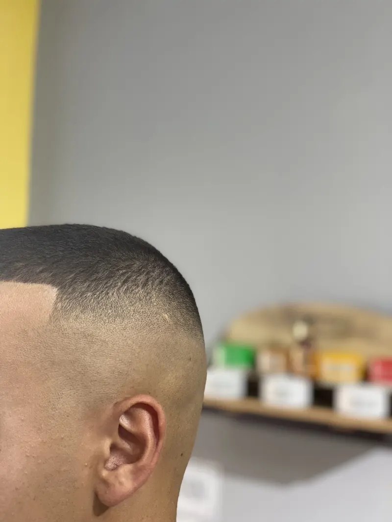 Close-up of a clean skin fade above the ear